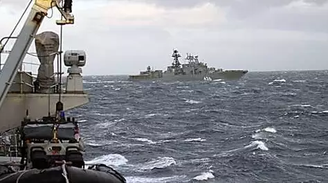 Russian destroyer escorted through firth