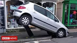 Parking fail leaves car on ticket machine